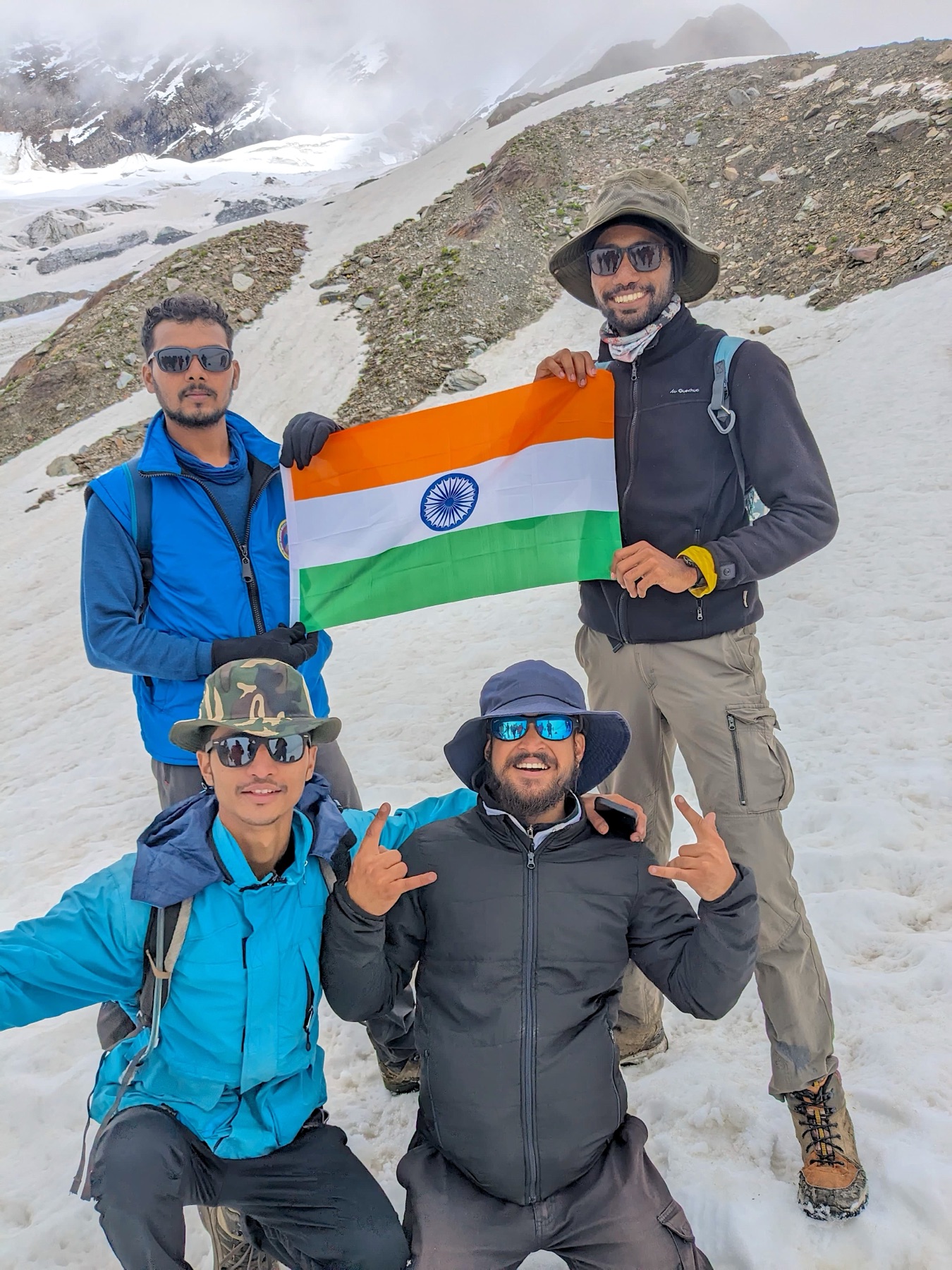 The team holding the Indian flag on a snow summit